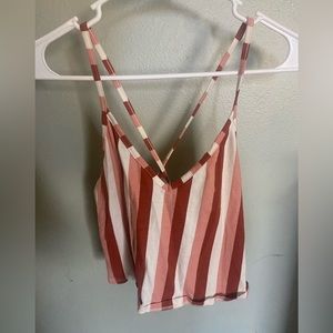 Crop top spaghetti strap. Crossed on the back.